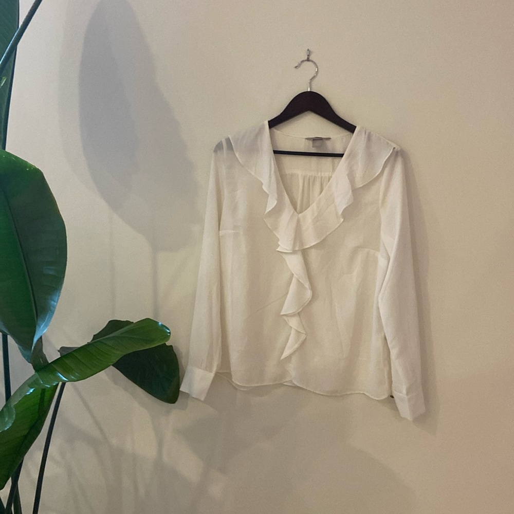 White ruffled blouse